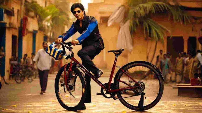 the world should ride a bicycle Shah Rukh Khan in saree holding a cycle.